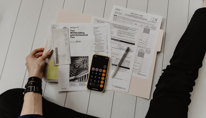 CPA auditor reviewing financial statements and audit documentation